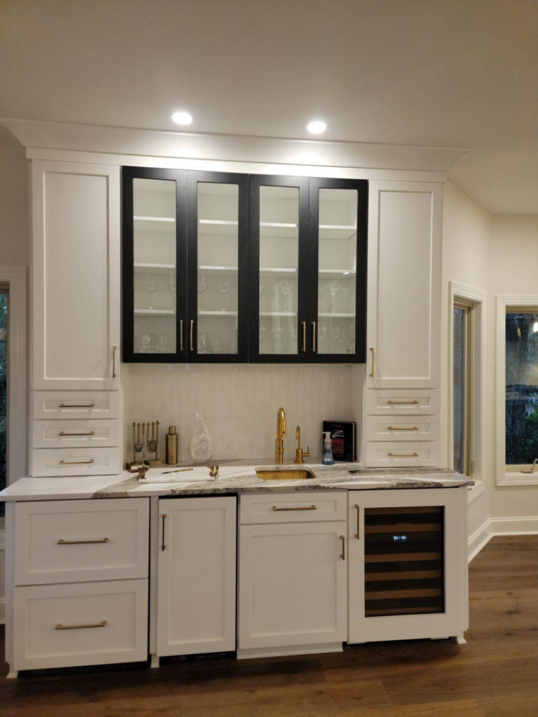 Recessed and under-cabinet lighting, and wine fridge electrical connection in a wet bar by D&R Construction & Electrical Services in Summerville, SC.