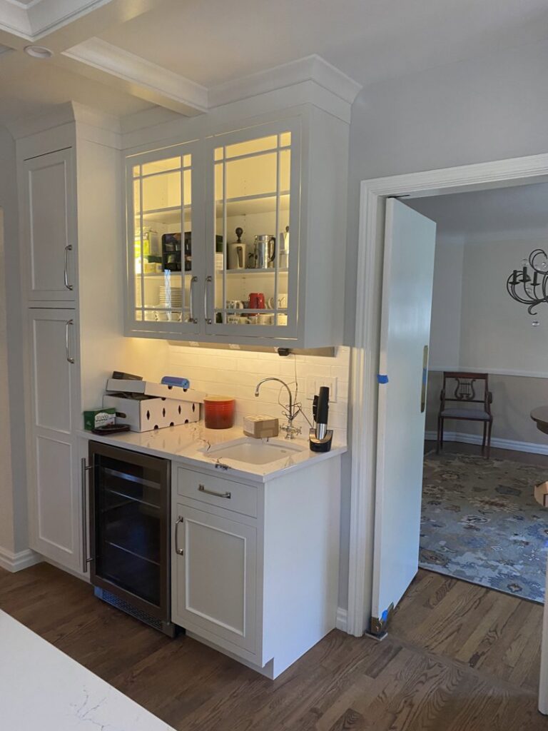 Wet bar with under-cabinet lighting and appliance hookups installed by All Electric llc in Denver, CO
