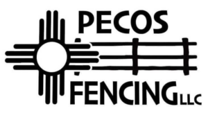 A long white corrugated metal fence with a matching gate installed by Pecos Construction and Fencing, LLC in Roswell, NM.