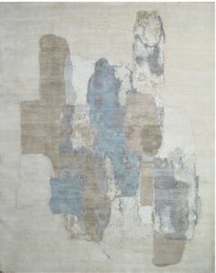 A white fluffy rug with bold black diamond patterns, offered by Organic Looms in Scottsdale, AZ