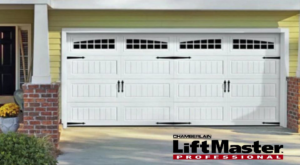 A newly installed white garage door with decorative windows and hardware by Garage Doors & Remodeling LLC in Blue Springs, MO