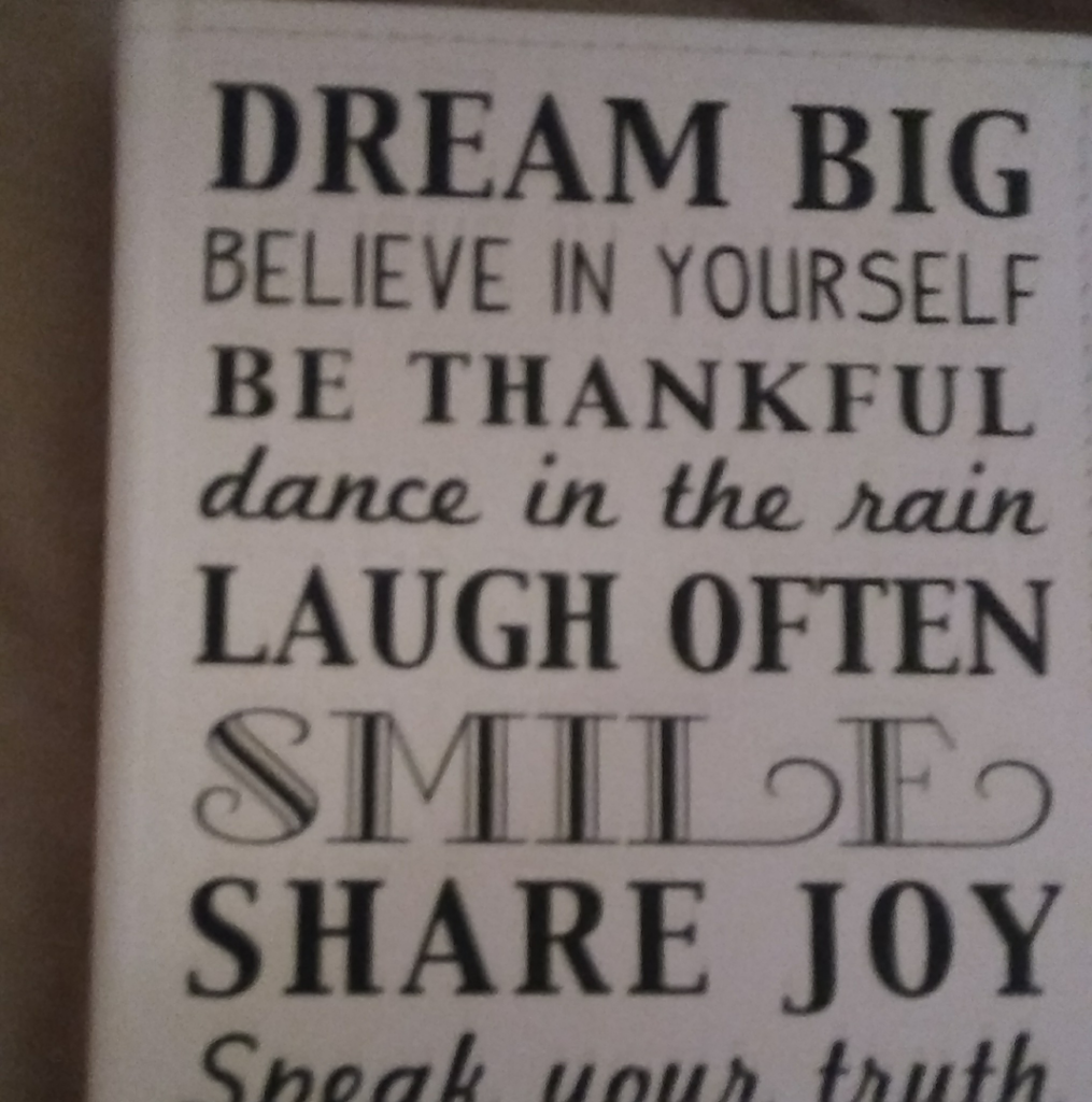 A newly installed white garage door with decorative windows and hardware by The Garage Door Kings in Peoria, AZ