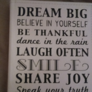 A newly installed white garage door with decorative windows and hardware by The Garage Door Kings in Peoria, AZ