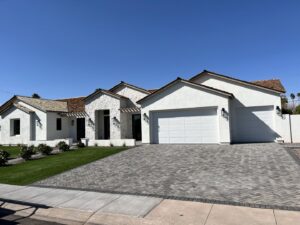 A white garage door installed on a modern home by Anew Garage by Jon's Garages in Surprise, AZ.
