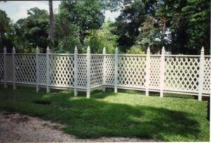 A white lattice decorative fence installed by A-1 Security Fence in Scott, LA.