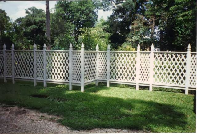 A white lattice decorative fence installed by A-1 Security Fence in Scott, LA.