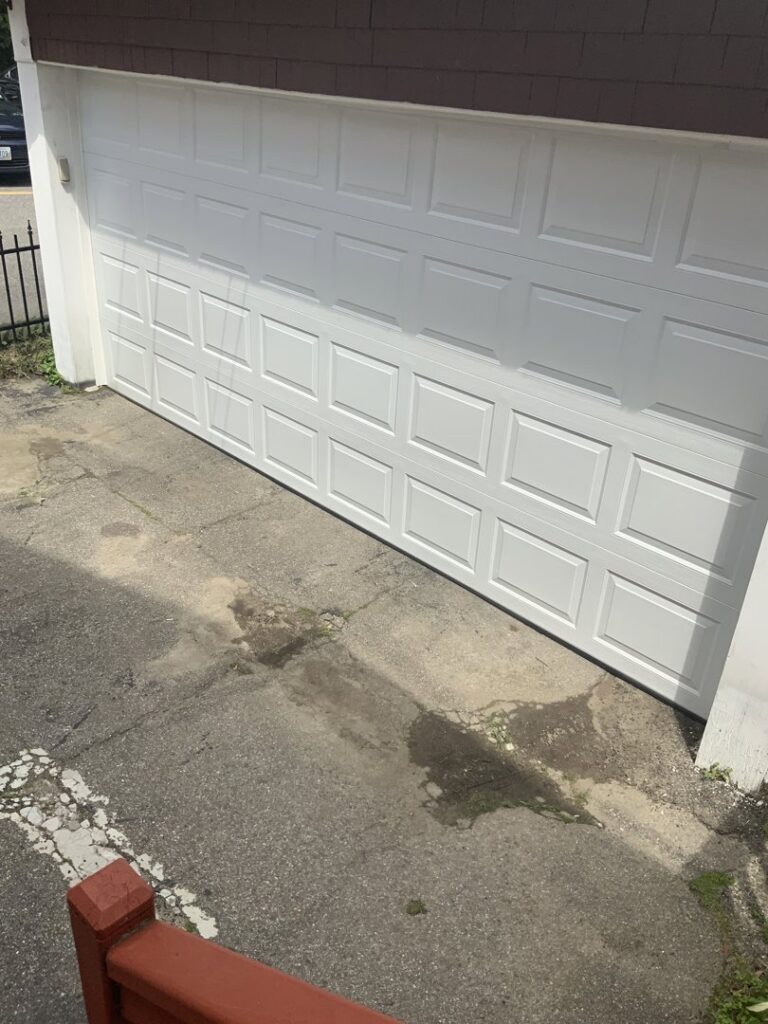 A white panel garage door installation by Snowbird Garage Doors Company in Worcester, MA.