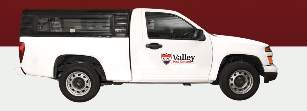 A white pest control truck with the Valley Pest Control logo, serving clients in Oshkosh, WI.