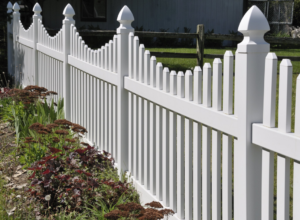 A newly installed white picket fence with decorative finials by Metrofence in Grand Rapids, MI.