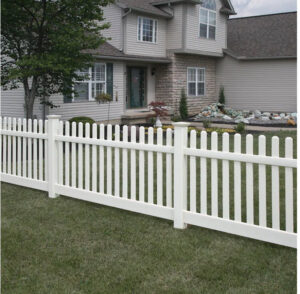A classic white picket fence installed for a residential property by Fence, Gates and Rockwalls in Kailua-Kona, HI