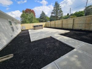 A classic white picket fence with a gate, installed by Hoplite Services in Indianapolis, IN.