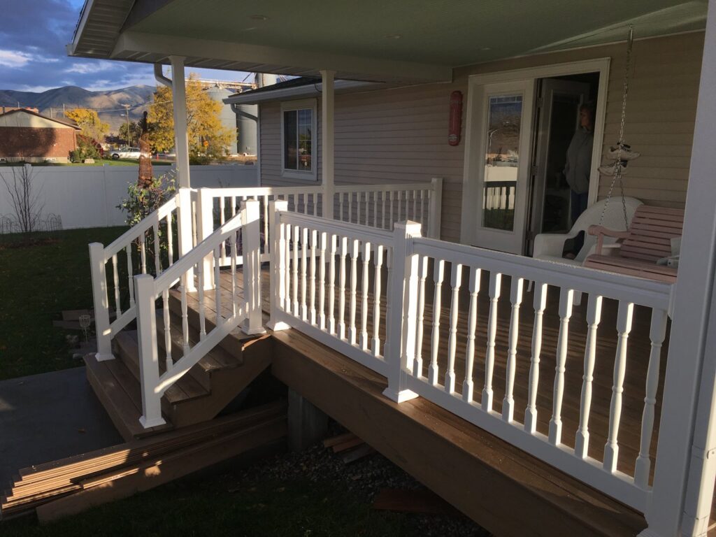 White vinyl deck railing installation completed by Sublime Fencing LLC in North Logan, UT.