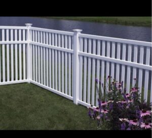 A white vinyl fence installed along a waterfront property by Austintown Fence in Youngstown, OH.