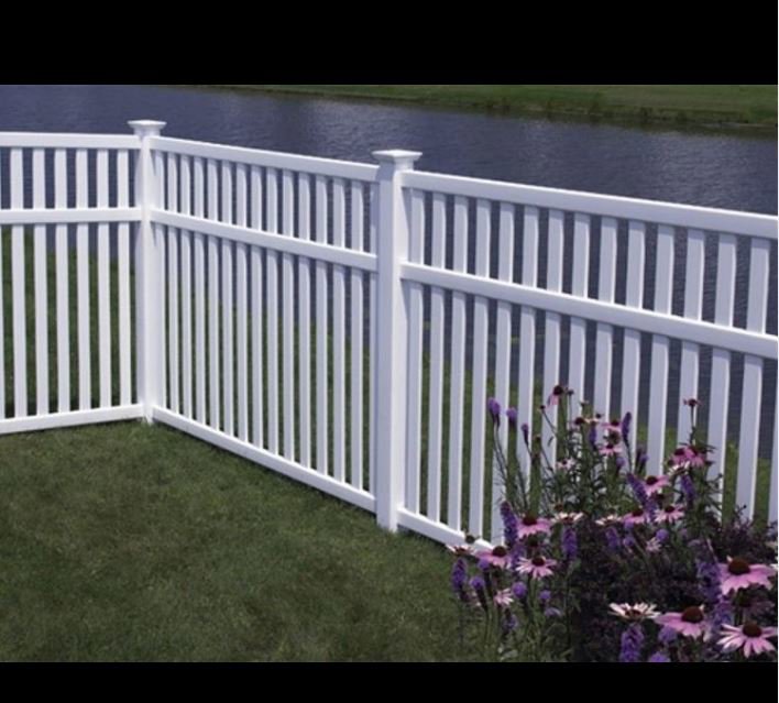 A white vinyl fence installed along a waterfront property by Austintown Fence in Youngstown, OH.