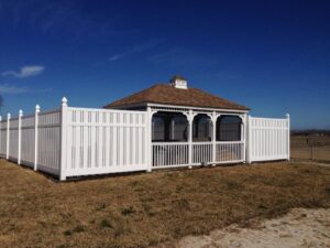 A white vinyl fence enclosing a gazebo, installed by A-1 Security Fence in Scott, LA.