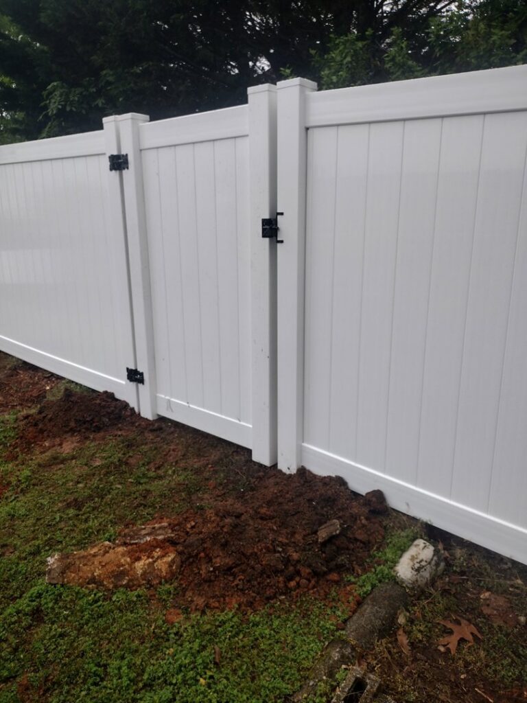 A newly installed white vinyl fence gate by Fantastic Fences in Chattanooga, TN