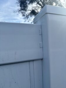 A detailed view of a white vinyl fence panel connection by Santis Fence & Home Service in Tampa Heights, FL