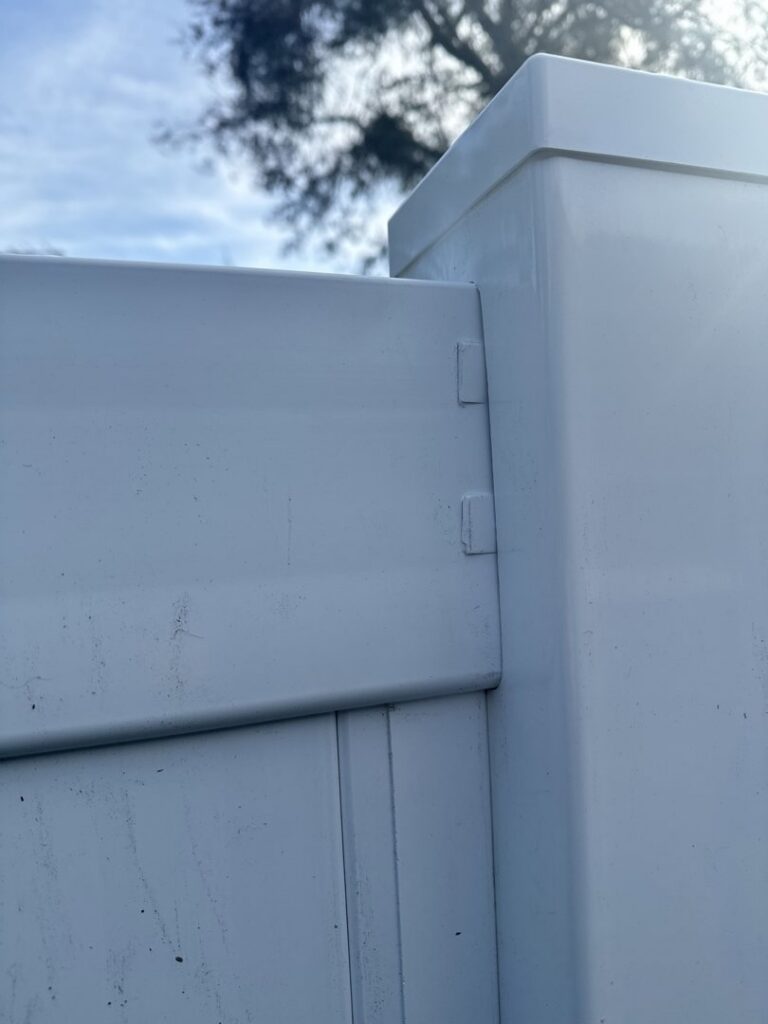 A detailed view of a white vinyl fence panel connection by Santis Fence & Home Service in Tampa Heights, FL
