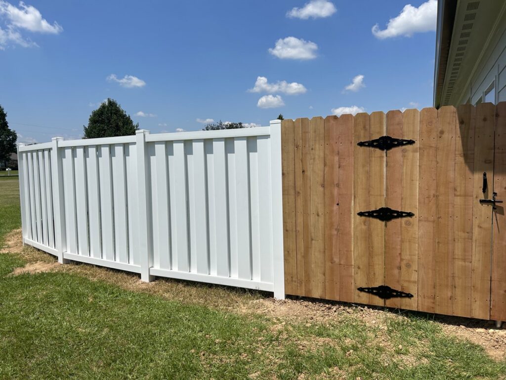 A combination white vinyl fence and wooden gate installed by A-1 Security Fence in Scott, LA.