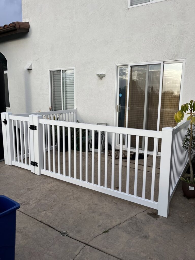A white vinyl fence enclosing a residential patio area installed by All Around Fence Page in Imperial Beach, CA.