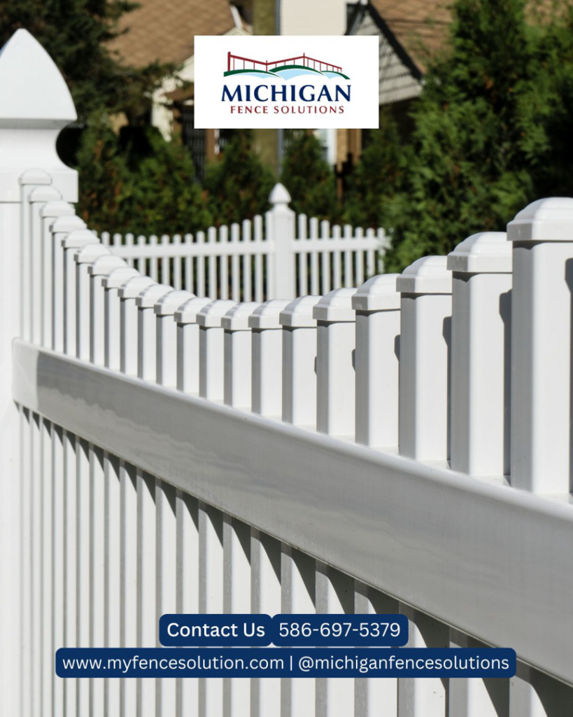 A close-up view of a white vinyl picket fence installed by Michigan Fence Solutions in Macomb, MI.