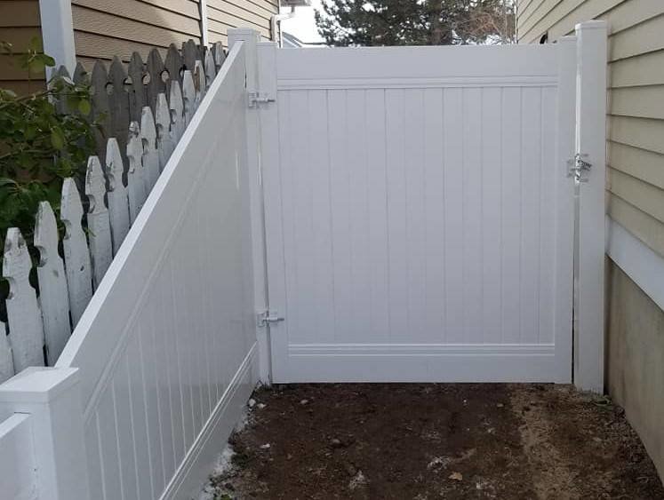 A new white vinyl privacy fence and gate installed by Allied Fence Co in Tulsa, OK.