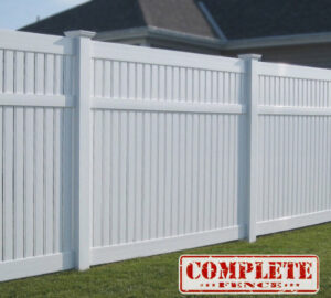 A pristine white vinyl privacy fence installation by Complete Fence, LLC in West Chicago, IL