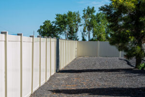 A newly installed white vinyl privacy fence by Fence Tech in Everett, WA, providing a clean boundary.