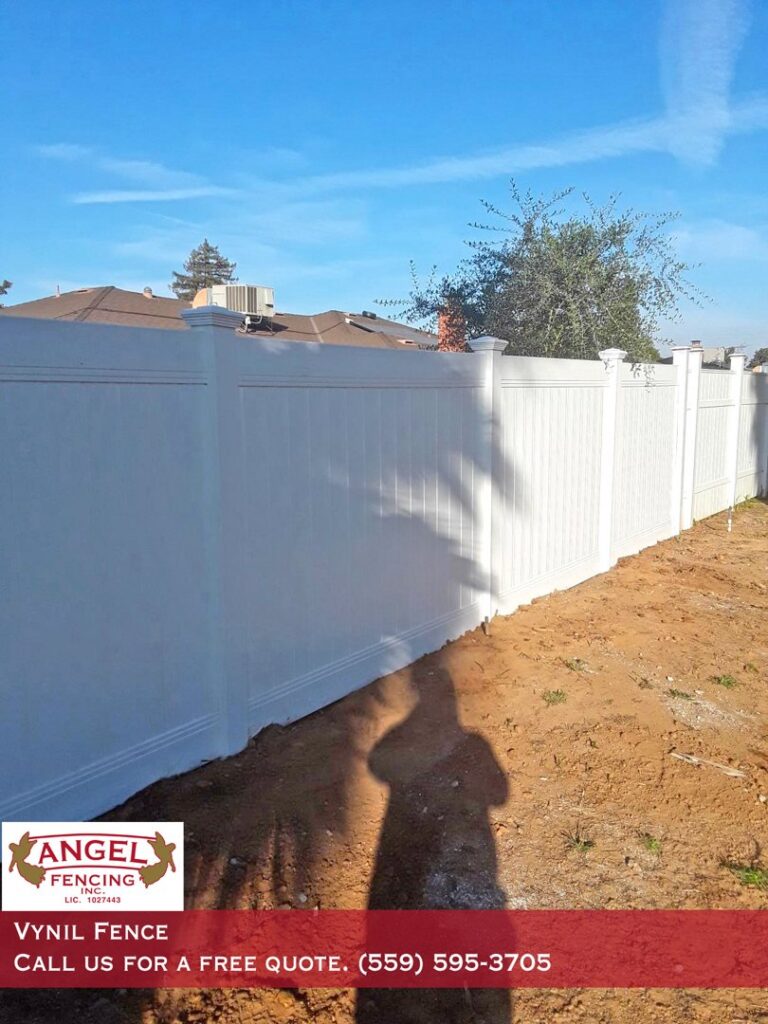 A white vinyl privacy fence installed for a residential property by Angel Fencing Inc. in Fresno, CA