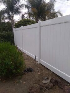 A pristine white vinyl privacy fence installed for a residential property by Los Angeles Fence Builders in Los Angeles, CA.