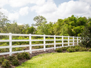 A classic white vinyl ranch-style fence installed by Superior Fence & Rail Richmond, VA.