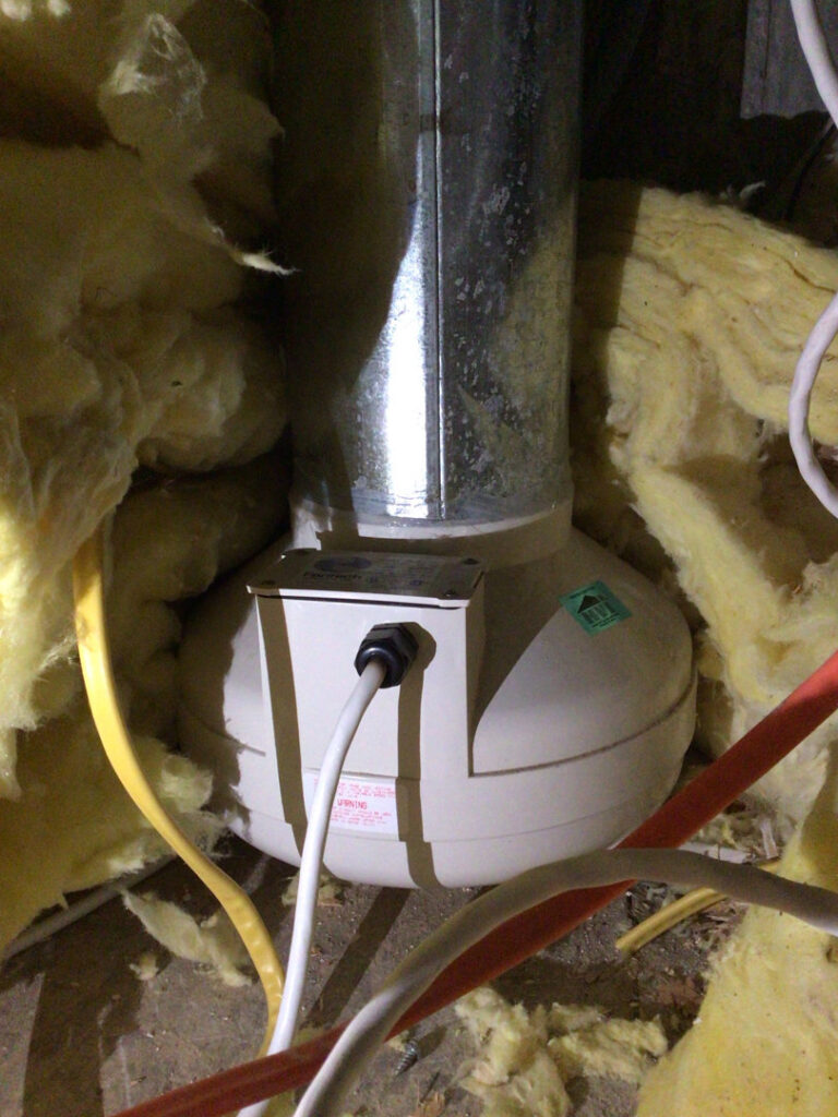 A whole-home humidifier or air purification unit installed with ductwork by Waymaker HVAC LLC in Colorado Springs, CO.