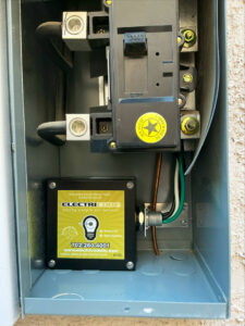 A newly installed whole home surge protector by Electricode inside an electrical meter box in Las Vegas, NV.