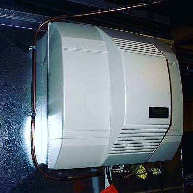 A whole-house humidifier unit installed on ductwork by Comfort-Tech llc in Alexandria, VA.