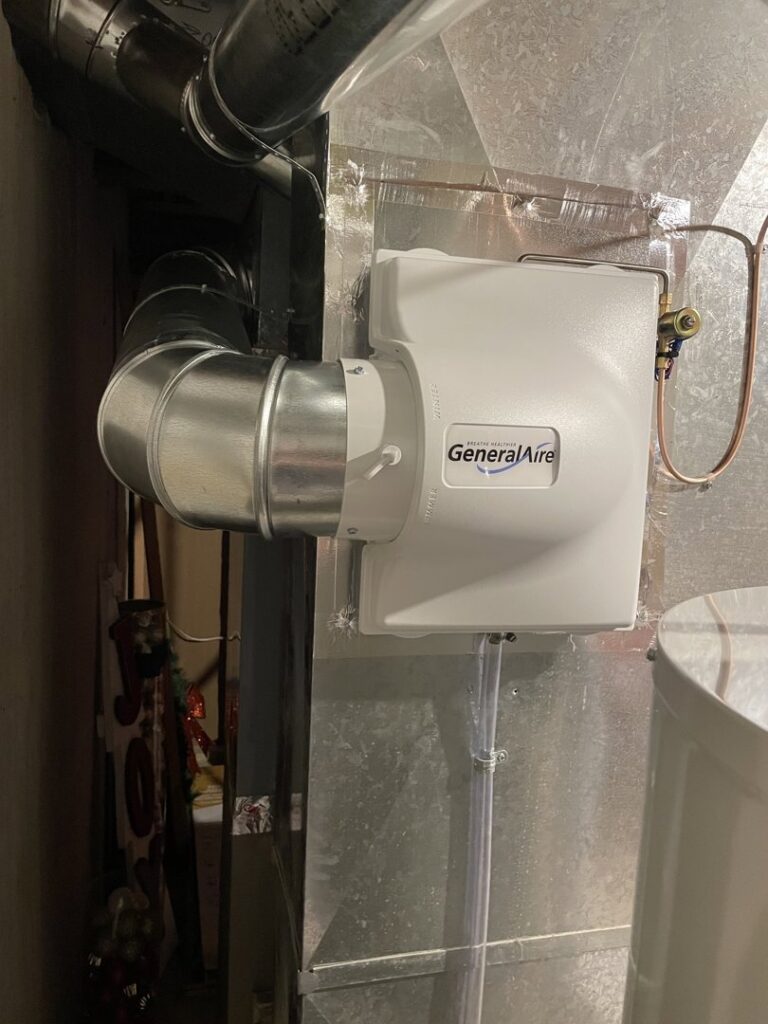 A GeneralAire whole-house humidifier installed on ductwork by A-Team PHC in Olathe, KS.
