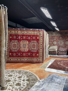 A wide selection of colorful oriental rugs displayed in the Khazai Rugs showroom in Lexington, KY