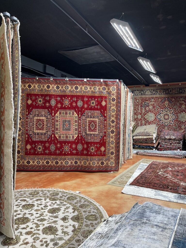 A wide selection of colorful oriental rugs displayed in the Khazai Rugs showroom in Lexington, KY