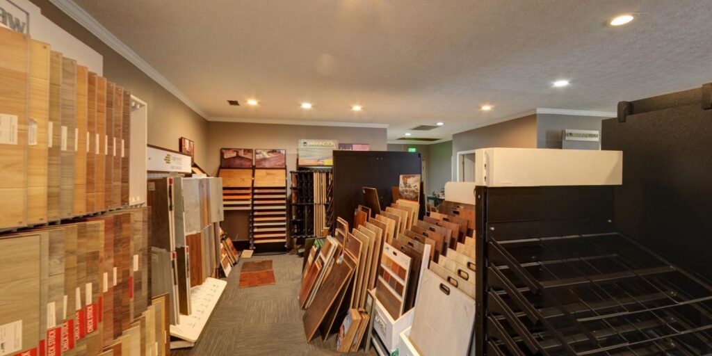 A wide view of the flooring showroom with carpeted aisles at Floor Concepts in Owensboro, KY.