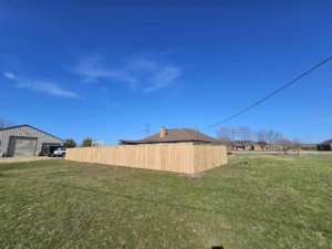 A wide view of a newly installed wood privacy fence by Straight Shot Solutions, LLC in Fort Worth, TX.