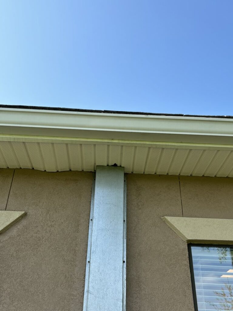 A metal barrier installed on a building for wildlife exclusion by Crawford Pest Control in Jacksonville, FL.