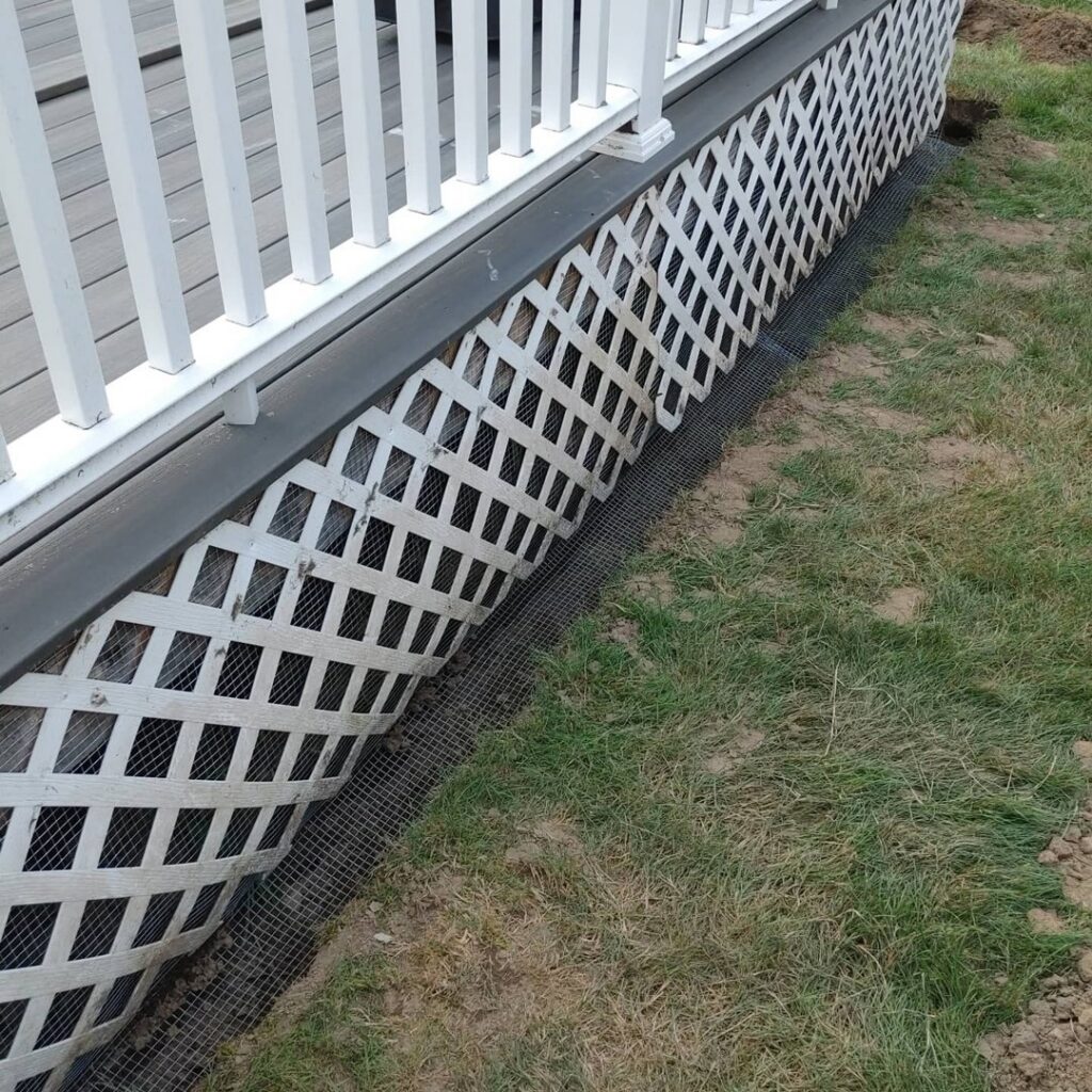 Wire mesh installed for wildlife exclusion along the base of a deck by Pest Express LLC in Rochester, NY