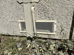 Mesh covers installed over vents for wildlife exclusion by Animal Boy Trapping Services LLC in Long Beach, CA.