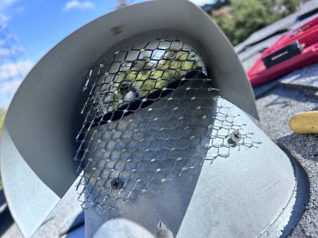 A metal mesh installed for wildlife exclusion on a roof vent by Dan's Pest Management in Bakersfield, CA