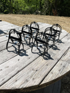 Several wildlife traps, likely for moles, laid out by Metro Pest Solutions for pest control in West Des Moines, IA.