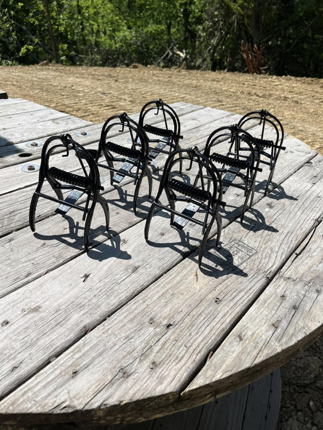 Several wildlife traps, likely for moles, laid out by Metro Pest Solutions for pest control in West Des Moines, IA.