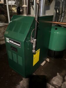 A green Williamson brand furnace or boiler installed by Done Right Air in West Allis, WI