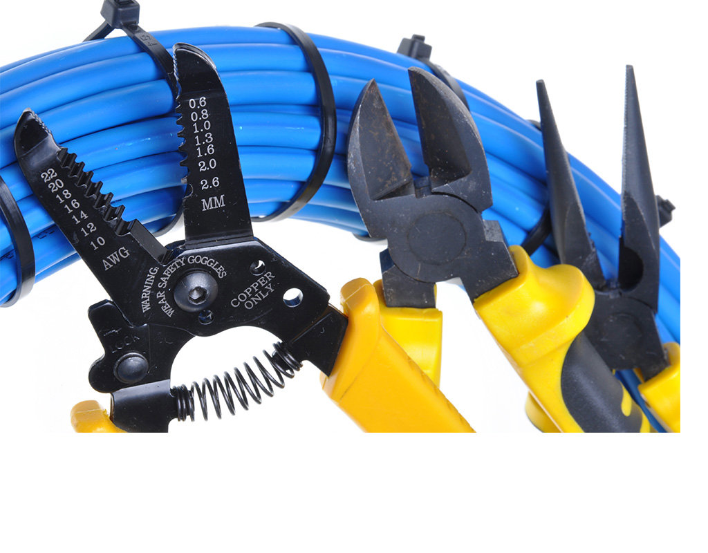 Wire strippers, pliers, and bundled electrical cables, tools used by Thompson Electric in Elizabethtown, KY.