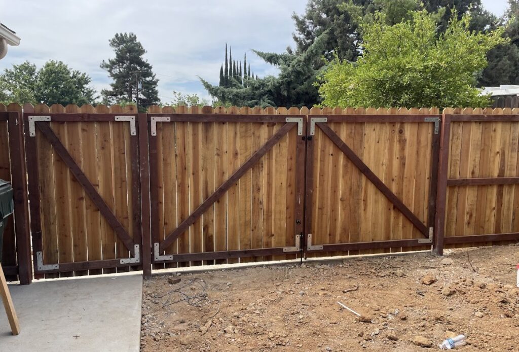 A sturdy wood double gate with diagonal bracing for added support, installed by True American Fence Supply and Construction in Anaheim, CA.