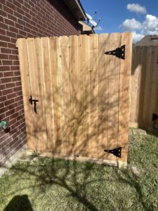 A custom wood fence expertly built around an existing tree by Wood Fence Houston in Houston, TX.