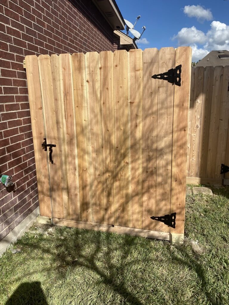 A custom wood fence expertly built around an existing tree by Wood Fence Houston in Houston, TX.
